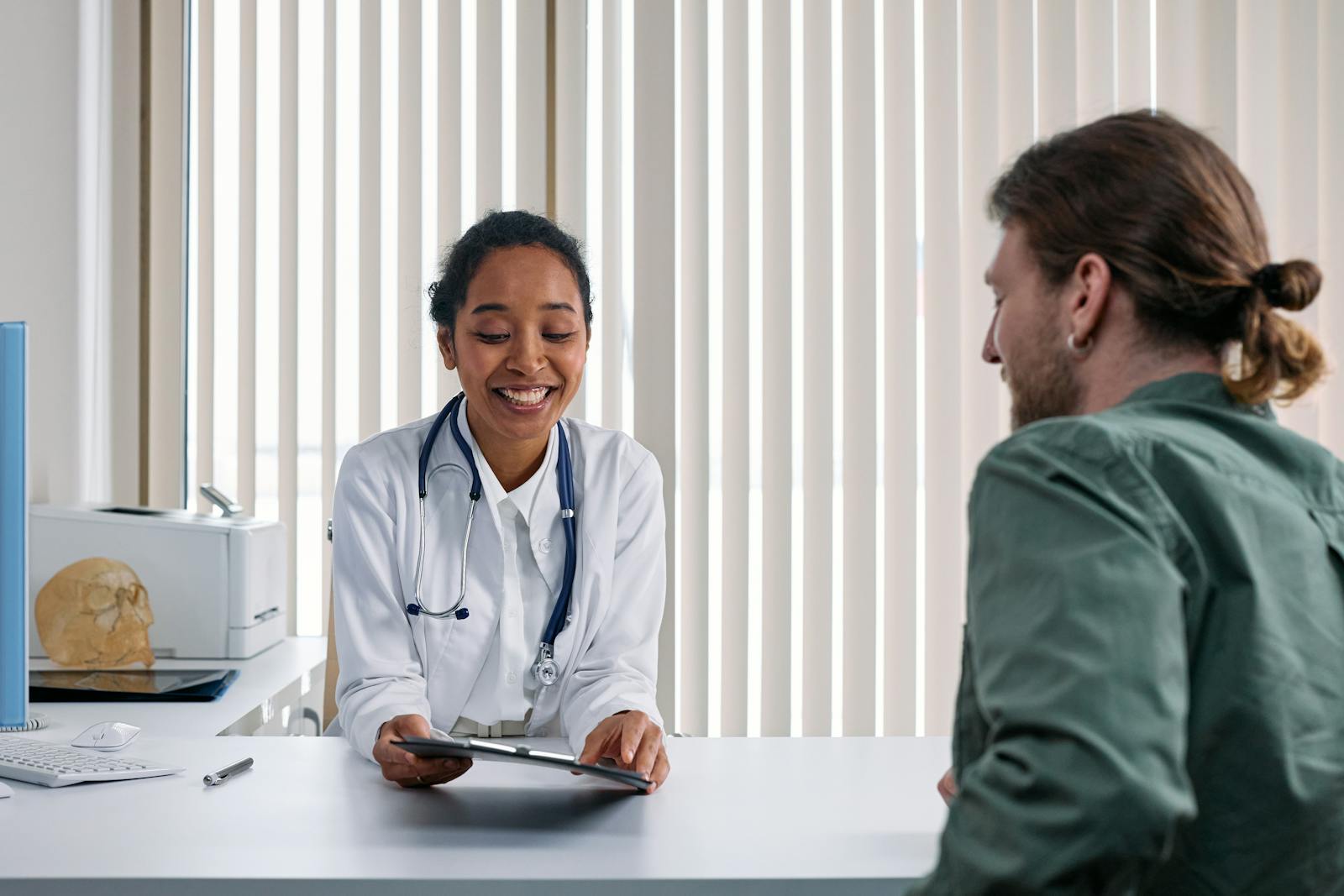 A coordinator and patient in conversation at the clinic