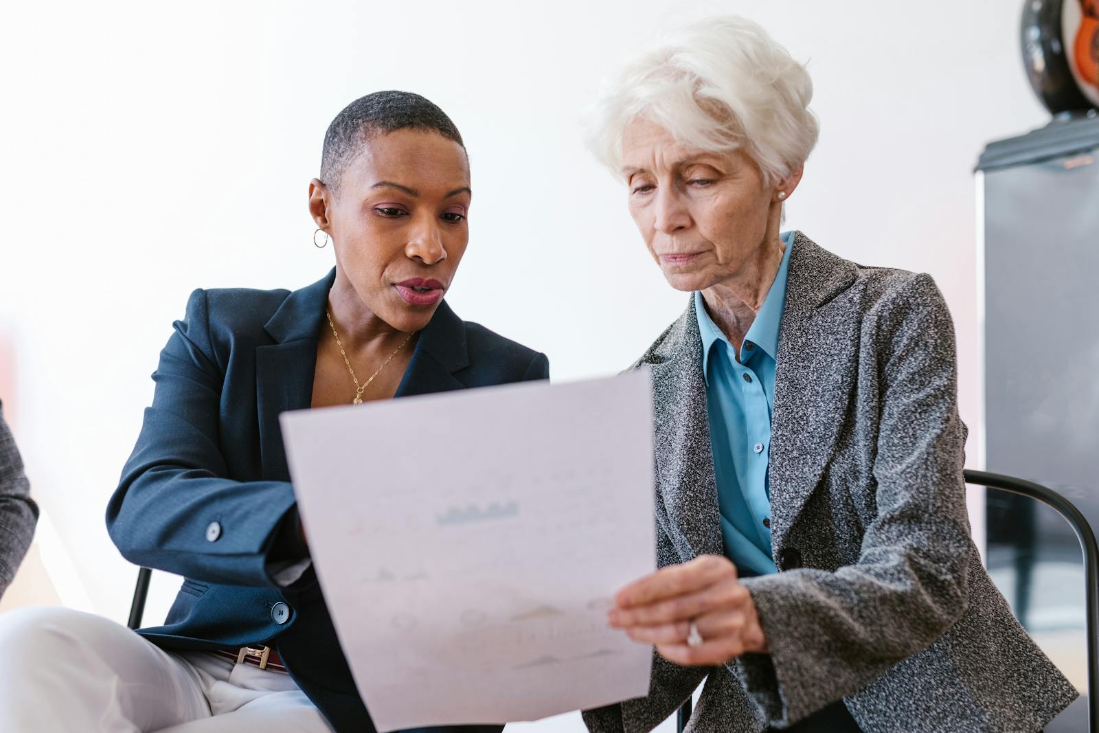 Two coordinators reviewing a case document together